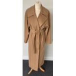 A Burberrys Lady's Camel Coloured Cashmere Belted Full-Length Swing Coat, 1980s/1990s, with button