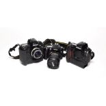 Nikon Camera Group D1H with Nikkor-H f2 50mm lens, D90 with AF-S f3.5-5.6 18-200mm lens and D1