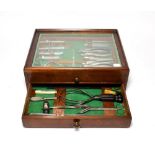 Surgical Instruments Set in two drawer mahogany cabinet with glazed top 17x13x6'', 43x33x15cm