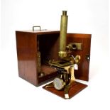 Negretti & Zambra Brass Microscope with single lens turret, fine/course focusing, adjustable stage