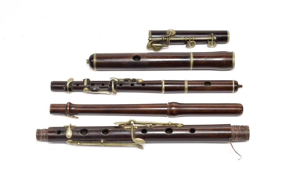 Wooden Flute three sections, two stamped 'F. Besson London', eight keys and six holes, length from