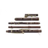 Wooden Flute three sections, two stamped 'F. Besson London', eight keys and six holes, length from