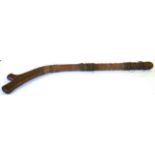 A 19th Century Fijian Gun Stock War Club, of hard dense golden brown wood, with raised medial