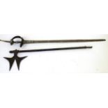 An 18th Century Indian Khanda, the 88cm single edge steel blade with a narrow fuller along the