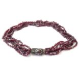 A Six Strand Garnet Bead Necklace, length 42.5cm