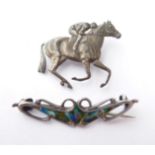 An Arts & Crafts Enamel Silver Brooch; and A Horse and Jockey Brooch, stamped 'STERLING SILVER' (