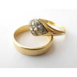 An 18 Carat Gold Band Ring, finger size K; and A Diamond Cluster Ring, finger size M1/2. Band ring -