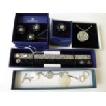 A Swarovski Necklace and Bracelet Suite; A Swarovski Necklace, Earring and Ring Suite; and Two