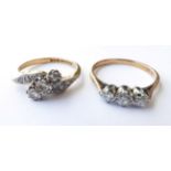 A Diamond Three Stone Ring, stamped '18CT', finger size M; and A Diamond Three Stone Twist Ring,