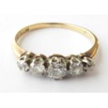 A Diamond Five Stone Ring, stamped '18CT', finger size M1/2. Gross weight 1.9 grams.