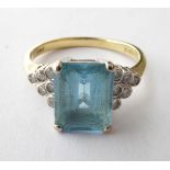 An 18 Carat Gold Topaz and Diamond Ring, finger size N1/2. Gross weight 3.7 grams.
