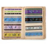 French Silk Ribbon Samples, early 20th century Enclosing decorative woven ribbons mainly in a