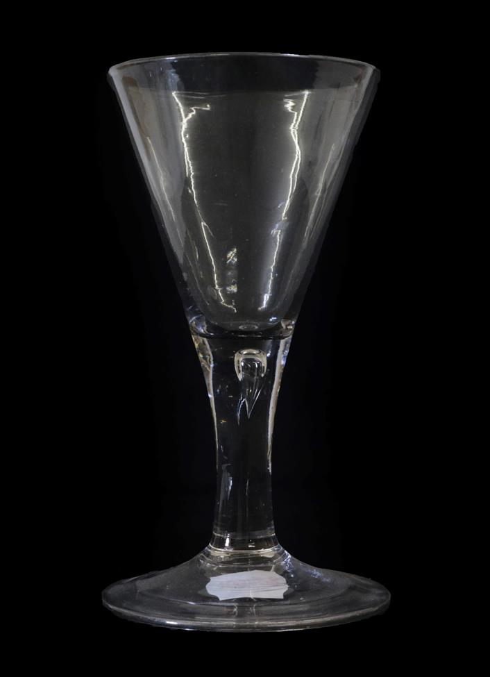 A Goblet, circa 1750, the drawn trumpet bowl on plain stem with air tear and folded foot, 21.5cm