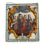 A Stained Glass Panel, in 17th century Dutch style, depicting four ladies at prayer within a leaf