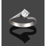 A Platinum Diamond Solitaire Ring, the round brilliant cut diamond in a four claw twisted shoulder