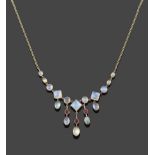 An Edwardian Moonstone and Garnet Necklace, circa 1900, graduated vari-cut cabochon moonstones