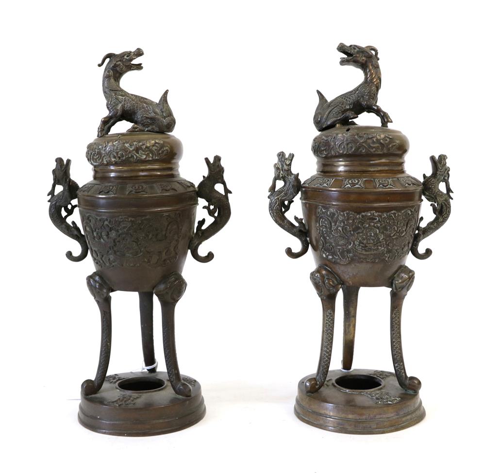 A Pair of Chinese Bronze Censers and Covers, late 19th century, of ovoid form with kylin knops and