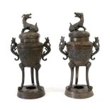 A Pair of Chinese Bronze Censers and Covers, late 19th century, of ovoid form with kylin knops and