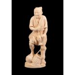 A Japanese Ivory Okimono as a Fisherman, Meiji period, standing holding a fish on a line leaning