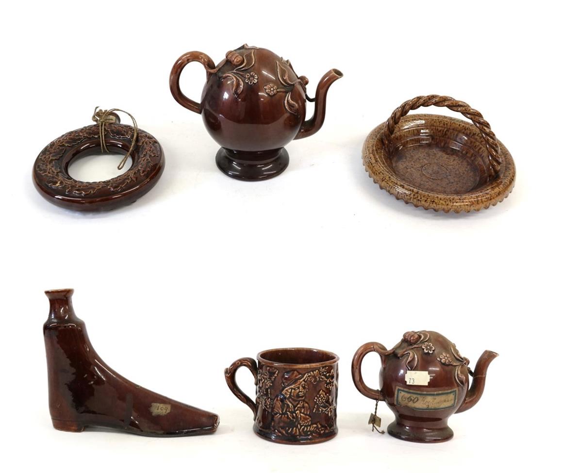 A Treacle Glaze Cadogan Teapot, circa 1840, of traditional form, indistinct impressed mark, 22cm