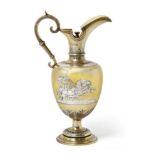 A Victorian Parcel-Gilt Silver Claret-Jug, by Edward Charles Brown, London, 1874, baluster and on