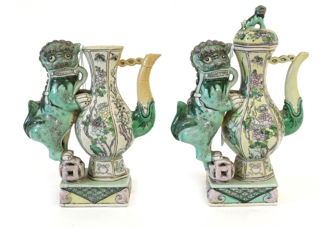 A Pair of Chinese Bisque Ewers and A Cover, in Kangxi style, of baluster form with dog of fo handles