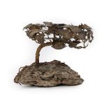 A Japanese Bronze Model of a Bonsai Tree, Meiji period, on a stone base, 16.5cm high. Damage to