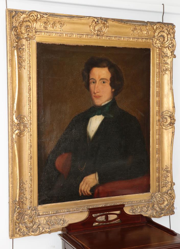 British School (19th century) Portrait of a gentleman, seated, in a red armchair Oil on canvas, 82.