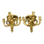 A Pair of Giltwood and Gesso Three-Light Wall Brackets, 19th century, with gadrooned oval plinths