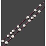 A Ruby and Cultured Pearl Necklace, faceted ruby roundel beads spaced by cultured pearls, length