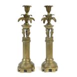A Pair of Brass Candlesticks, 19th century, with leaf cast sockets and drip pans on three owl