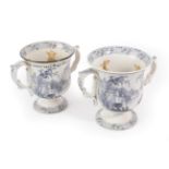 A Matched Pair of Pearlware Frog Loving Cups, circa 1830, of bell shape with leaf moulded handles,