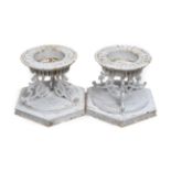 A Pair of Victorian Cast Iron Urn Bases, by Hunt & Pickering, repainted white, of circular form