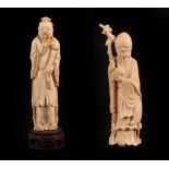A Chinese Ivory Figure of a Sage, 19th century, standing wearing flowing robes holding a ruyi