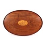 A Mahogany and Marquetry Tray, 19th century, of oval form with plain gallery and central satinwood