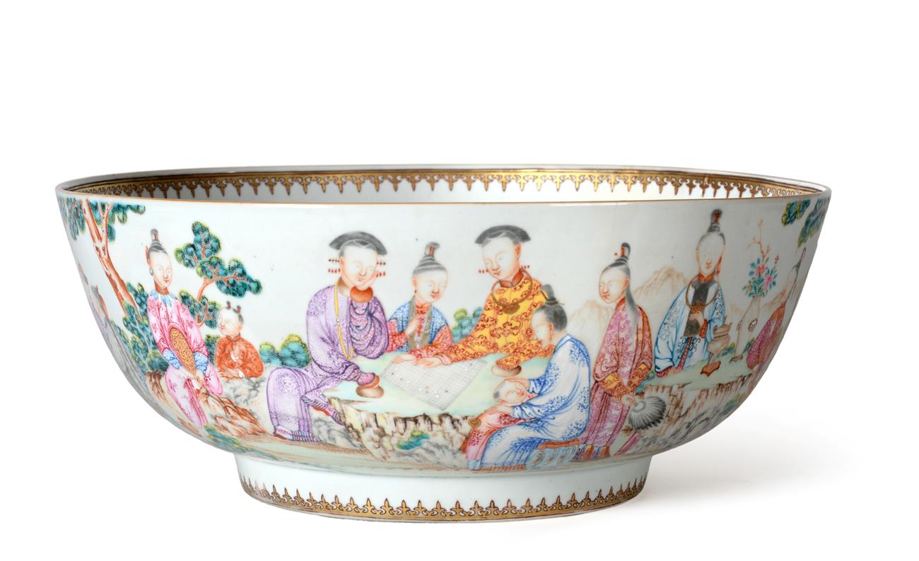 A Chinese Porcelain Punch Bowl, Qianlong, painted in famille rose enamels with figures at various