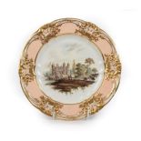 A Derby Porcelain Plate, circa 1810, painted with figures beside a river, a bridge and country house