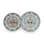 A Matched Pair of English Delft Plates, mid 18th century, painted in colours with baskets of flowers