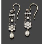 A Pair of Edwardian Diamond and Pearl Drop Earrings, circa 1900, an old cut diamond suspends two