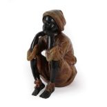 A Bergman Cold Painted Bronze Figure of an Arab Boy, early 20th century, seated with head resting on