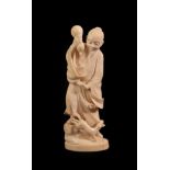 A Japanese Ivory Okimono of a Sage, Meiji period, standing in flowing robes holding a gourd, a