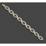 An Emerald and Diamond Bracelet, articulated links each set with an oval cut emerald within a