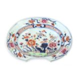 A Chinese Imari Porcelain Barber's Bowl, 18th century, of ovoid form, painted with flowers and