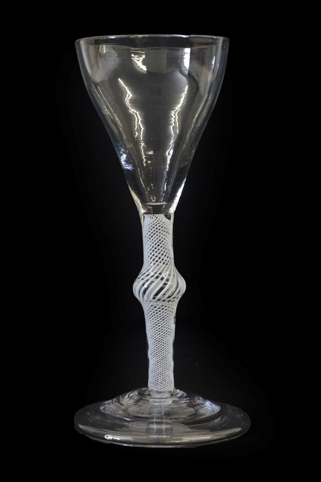 A Wine Glass, circa 1750, the tulip shaped bowl on an opaque twist stem with central knop and folded