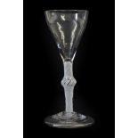 A Wine Glass, circa 1750, the tulip shaped bowl on an opaque twist stem with central knop and folded