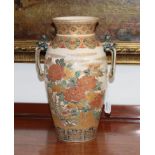 A Satsuma Earthenware Vase, Meiji period, of baluster form with flared neck and twin mask handles,