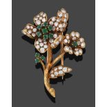 An Emerald and Diamond Flower Clip/Brooch, the flower centres formed of round cut emeralds to petals