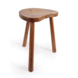 Workshop of Robert Mouseman Thompson (Kilburn): An English Oak Cow Stool, post 1970, the kidney