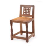 Robert Mouseman Thompson (1876-1955): An English Oak Low Lattice Back Chair, 1940's/50's, with