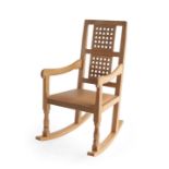 Workshop of Robert Mouseman Thompson (Kilburn): An English Oak Rocking Chair, with two lattice panel